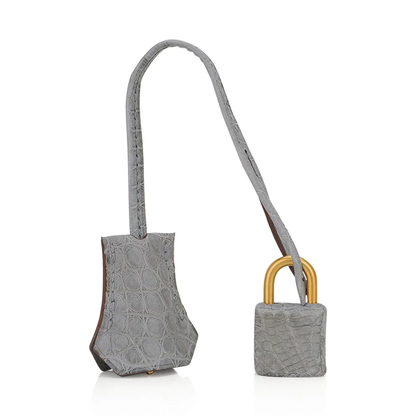 Pale Cream And Muted Ash Grey Scaled Embossed Dual-Tone Rigid Rectangular Hand Tote With Brushed Golden Twist Lock Hardware And Matching Scaled Padlock Charm