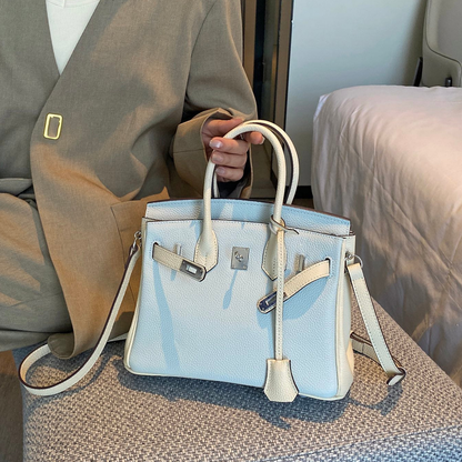Mist Light Blue Pebbled Grain Dual-Tone Compact Trapezoid Hand Tote With Creamy Off-White Trim And Sleek Silvery Twist Lock Hardware Tag