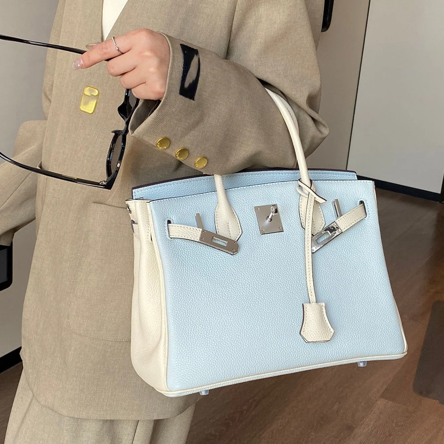 Mist Light Blue Pebbled Grain Dual-Tone Compact Trapezoid Hand Tote With Creamy Off-White Trim And Sleek Silvery Twist Lock Hardware Tag