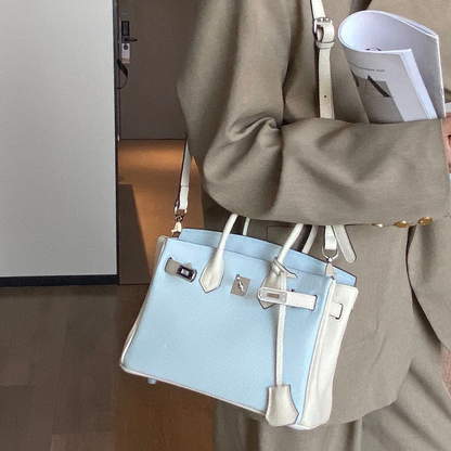 Mist Light Blue Pebbled Grain Dual-Tone Compact Trapezoid Hand Tote With Creamy Off-White Trim And Sleek Silvery Twist Lock Hardware Tag