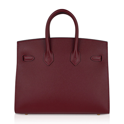 Deep Jewel Burgundy Fine Flat Grain Compact Box Structured Hand Tote With Radiant Golden Twist Lock Hardware And Matching Suspended Metal Padlock Charm